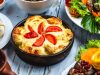 Свиная отбивная с помидорами, сыром и грибами в духовке